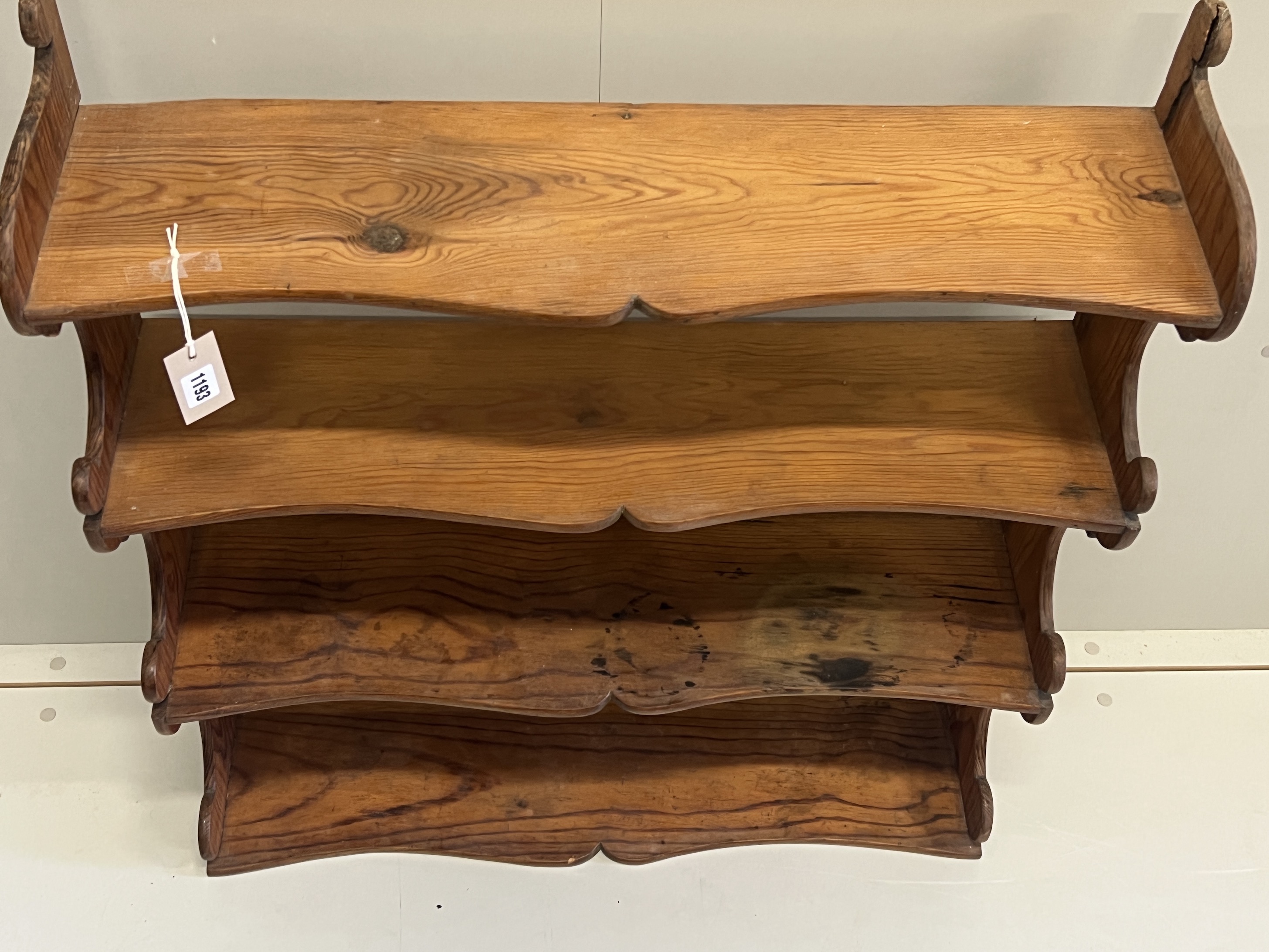 A Victorian pitch pine four tier wall bracket, width 75cm, depth 21cm, height 87cm